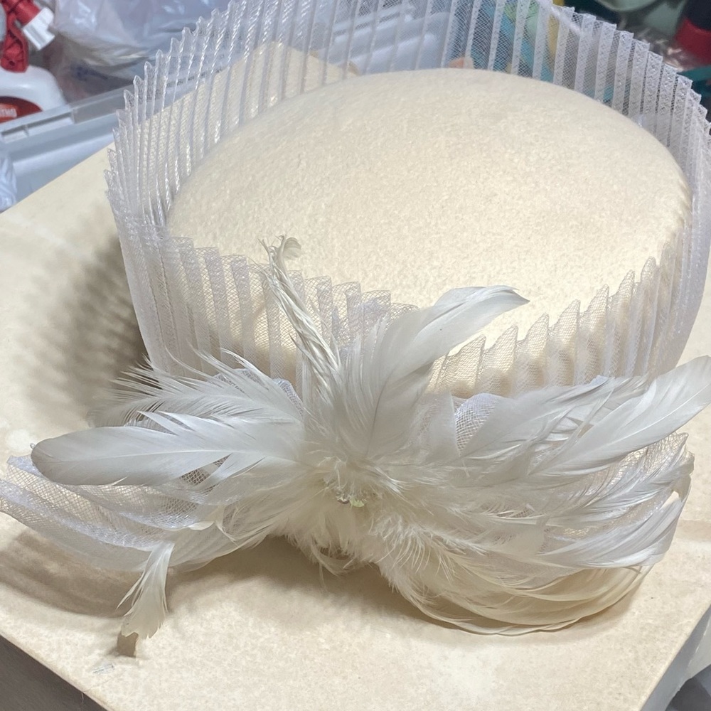 Ivory hat with gold & sequence trimming. Worn 1x.